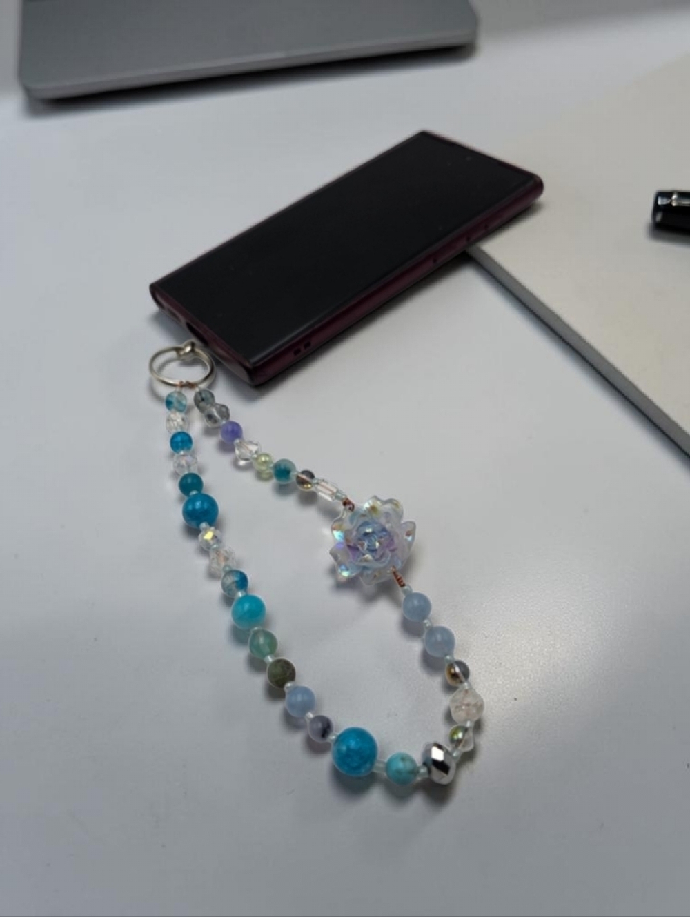 Handmade blue beaded phone charm